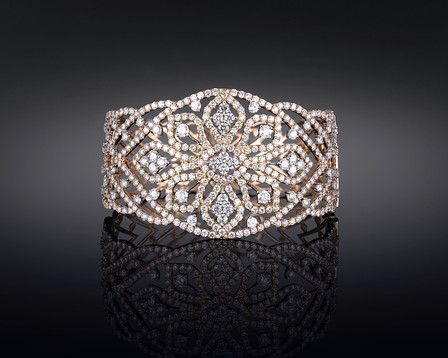 Four hundred and twenty four diamonds shimmer in this striking bangle cuff brace...