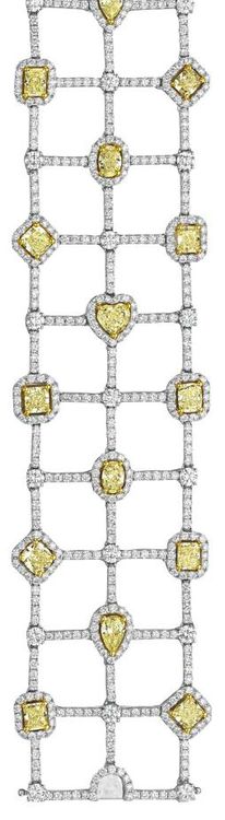 A Diamond and Yellow Diamond Bracelet....