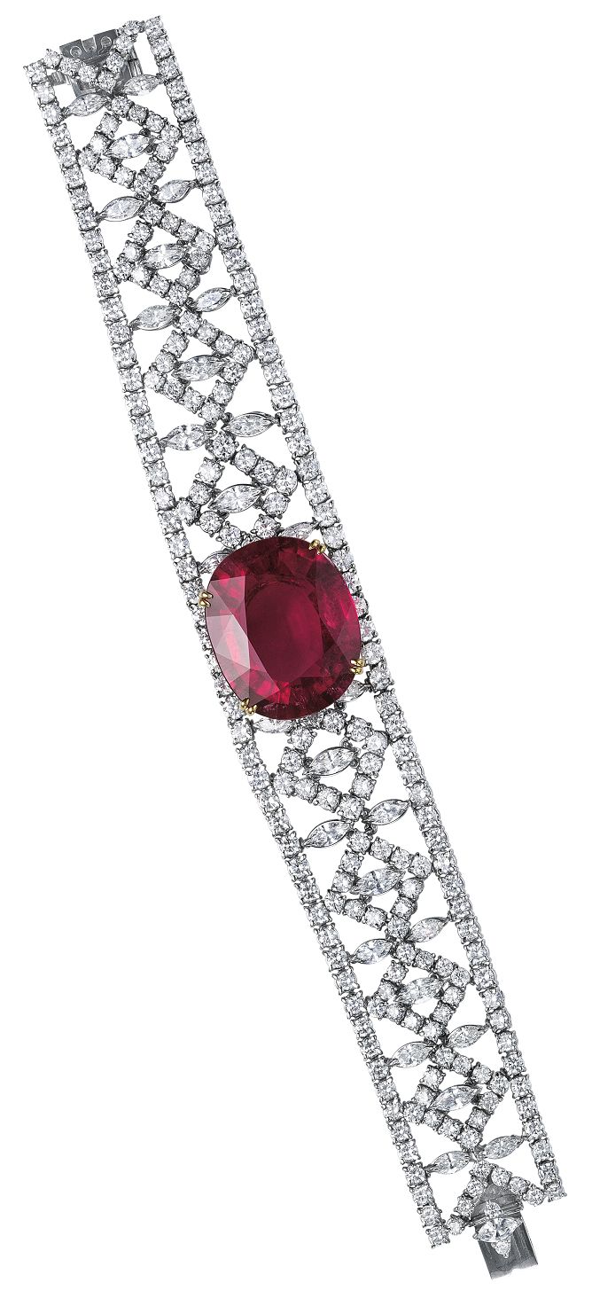 A rubellite and diamond bracelet centering on an oval-cut rubellite, weighing…