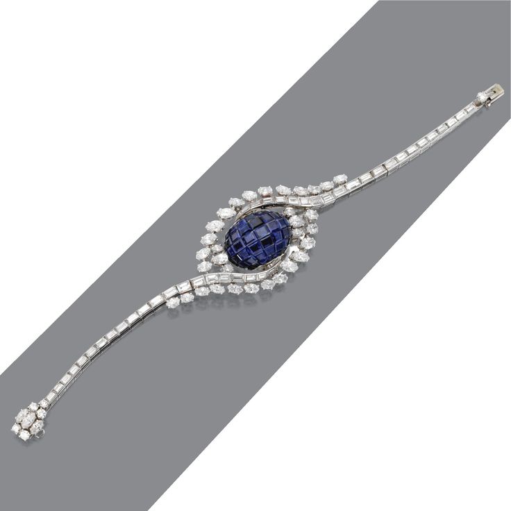 Diamond and sapphire bracelet-watch, Omega Centering a hinged arc decorated…...