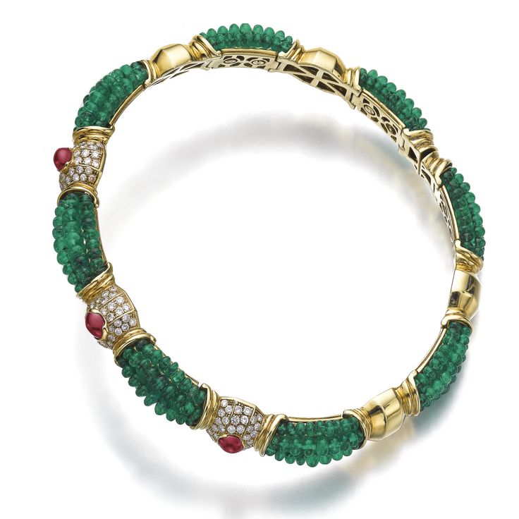 Emerald, ruby and diamond choker The flexible collar set with rows of emerald be...