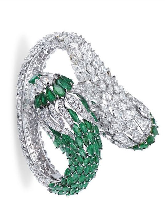 {IMAGE 1] A GROUP OF EMERALD AND DIAMOND JEWELLERY Comprising a hinged bangle of...