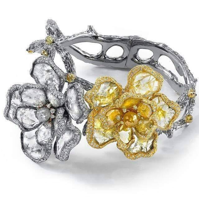 @levinsonjewelers one of a kind arm art. Beautiful diamond slices for flower pet...