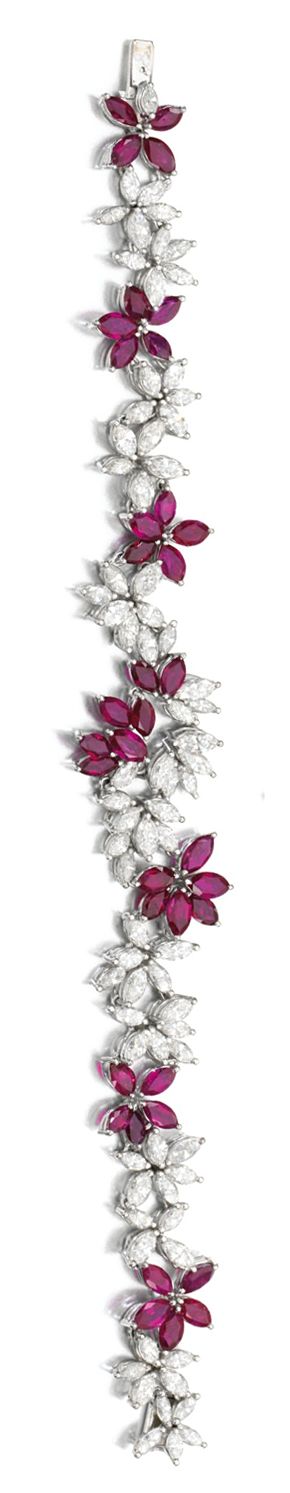 RUBY AND DIAMOND DEMI-PARURE Comprising: a necklace and bracelet each set with m...