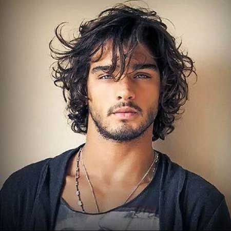 Long in front, medium hair length. Messy curly hairstyles for men
