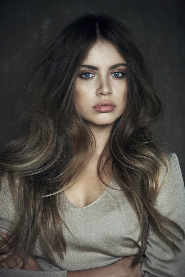 Beauty with full nude lips. Wavy hairstyle for long hair.