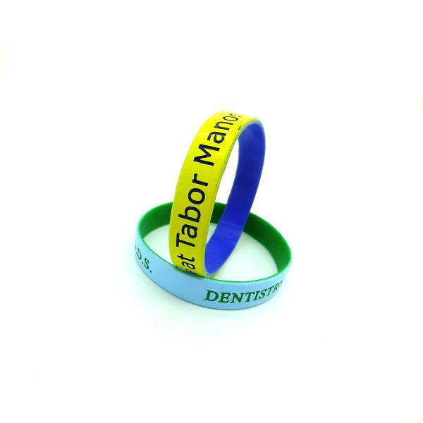 new fashion silicone bracelets with small badges #colorcoatedwristband #silicone...