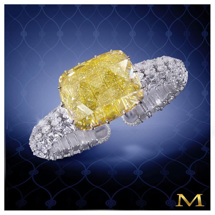 A sensational 35+ carat natural fancy yellow cushion-cut diamond mounted on a wh...