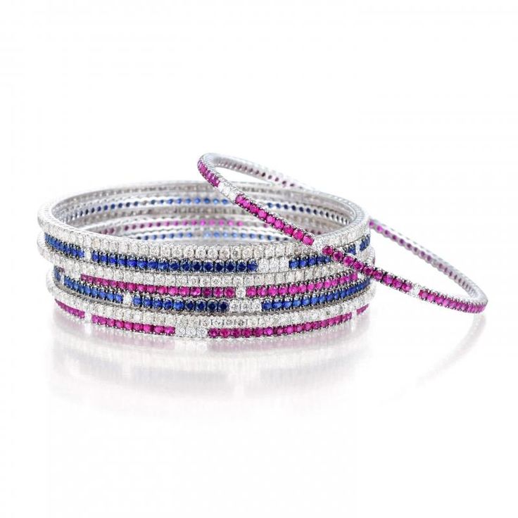 A Set of Eight Diamond, Ruby and Sapphire Bangles...