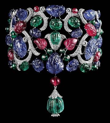 Cartier Tutti Frutti. Platinum, carved emeralds, rubies and sapphires, brilliant...