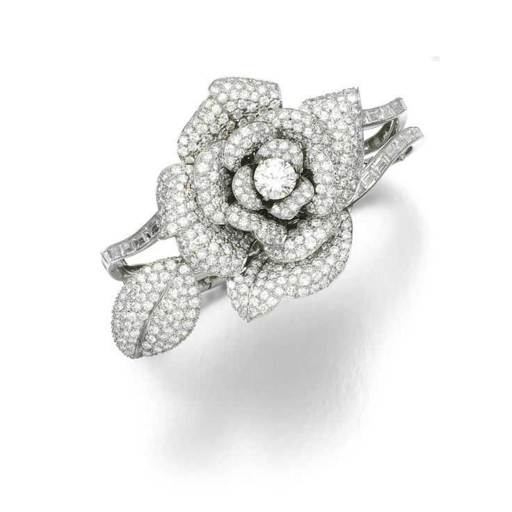 Diamond bracelet The central jewel designed as a rose, the petals and leaves pav...