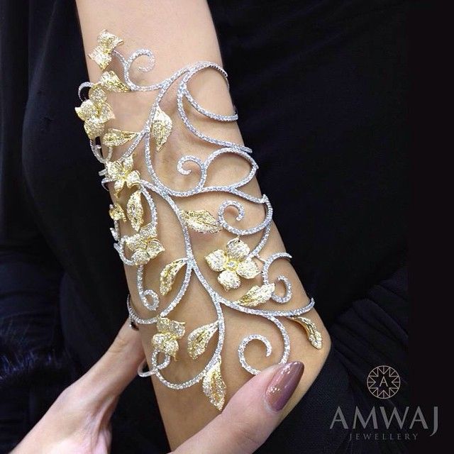 Exquisite , white and yellow bangle , shown at the International Jewellery Week,...