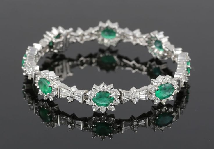 Ladies' bracelet, 14k white gold with diamonds and emeralds, having 6.40 tot...