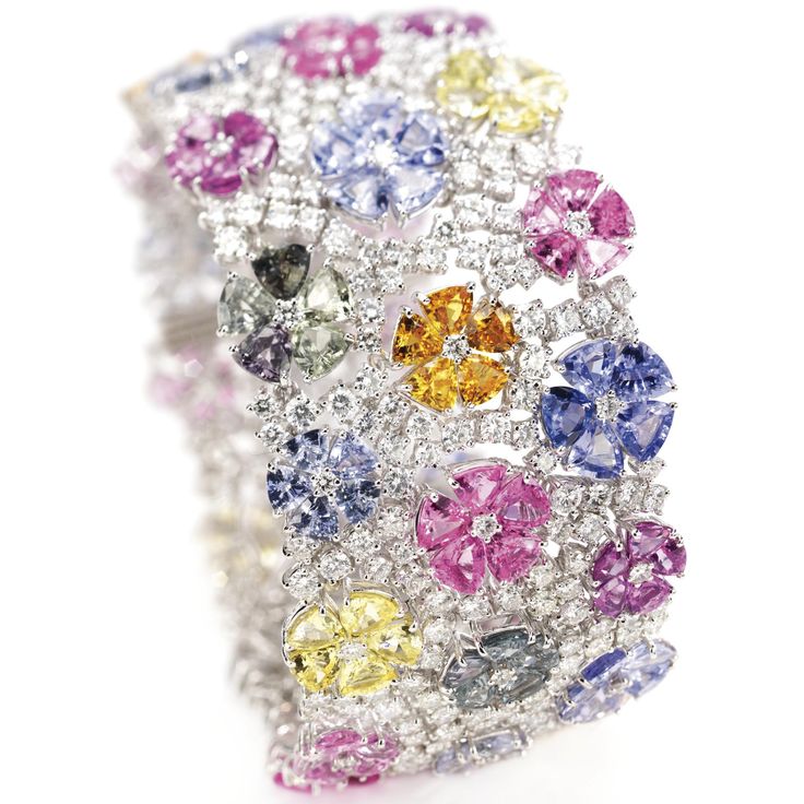 Multi-colored sapphire and diamond 'flower' bracelet The articulated sli...