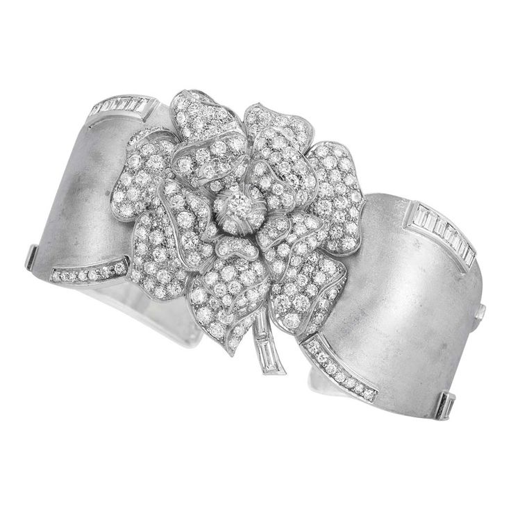 Platinum, Palladium and Diamond Flower Clip-Brooch Cuff Bangle The matte palladi...