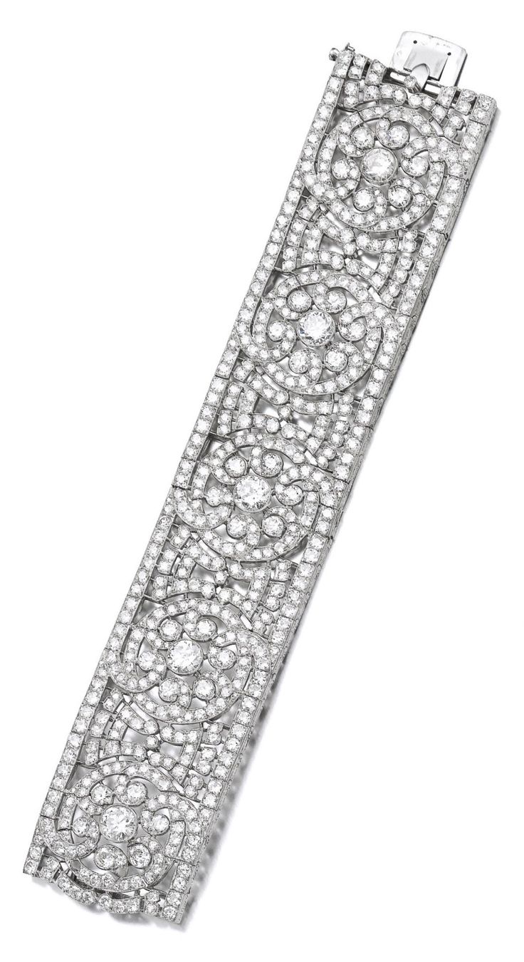 A fine Art Deco diamond bracelet, Van Cleef & Arpels, 1920s. Of scroll and open ...
