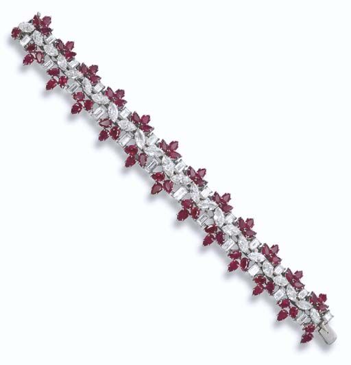 A RUBY AND DIAMOND BRACELET, BY HARRY WINSTON Designed as a line of marquise-cut...