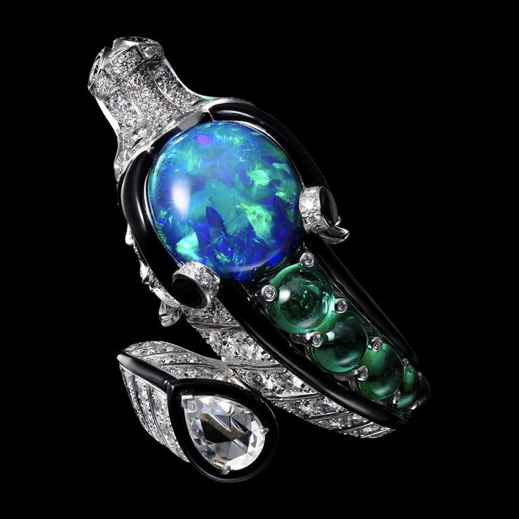 CARTIER. Ring - white gold, one 9.07-carat oval-shaped cabochon-cut black opal, ...