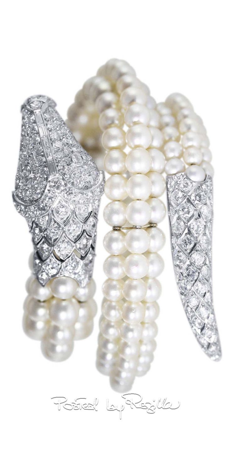 Regilla ⚜ A platinum, diamond and cultured pearl snake bracelet...