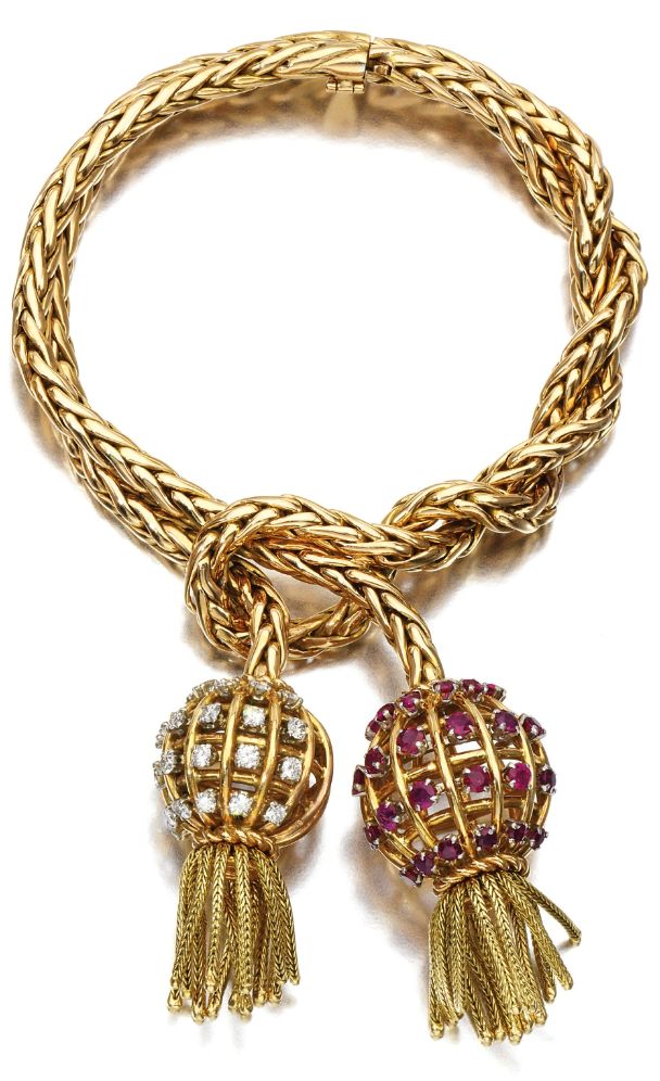 Retro gold, ruby, and diamond tassel bracelet by Sterlé, circa 1950. Via Diamon...