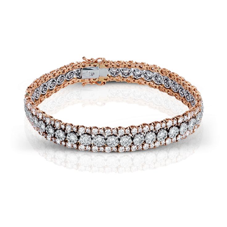 This lovely bracelet is crafted in two-tone 18k rose and white gold, and set wit...
