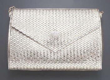 A WHITE GOLD AND DIAMOND EVENING BAG, BY CARTIER...