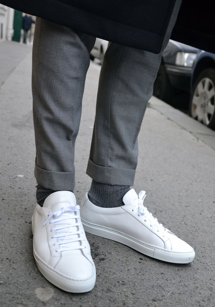 LES FRERES JOACHIM, white trainers with cuffed tailored trousers.