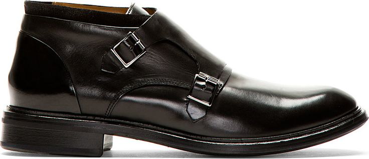 Mid-top buffed leather shoes in black. Round toe. Pin-buckle monk strap closure....
