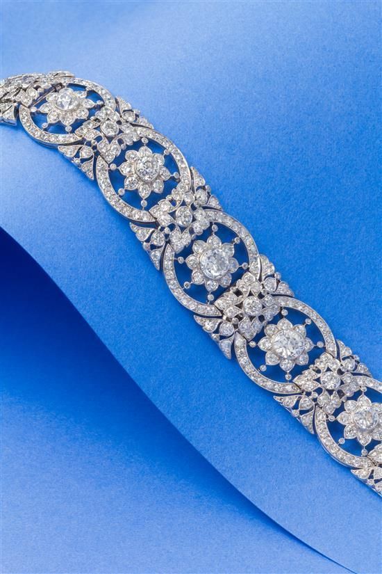 A Fine Platinum and Diamond Bracelet, Circa 1918, in an intricate openwork link ...