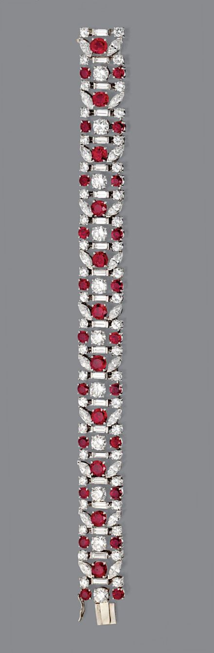 RUBY AND DIAMOND BRACELET, TIFFANY & CO., CIRCA 1950. The flexible band decorate...