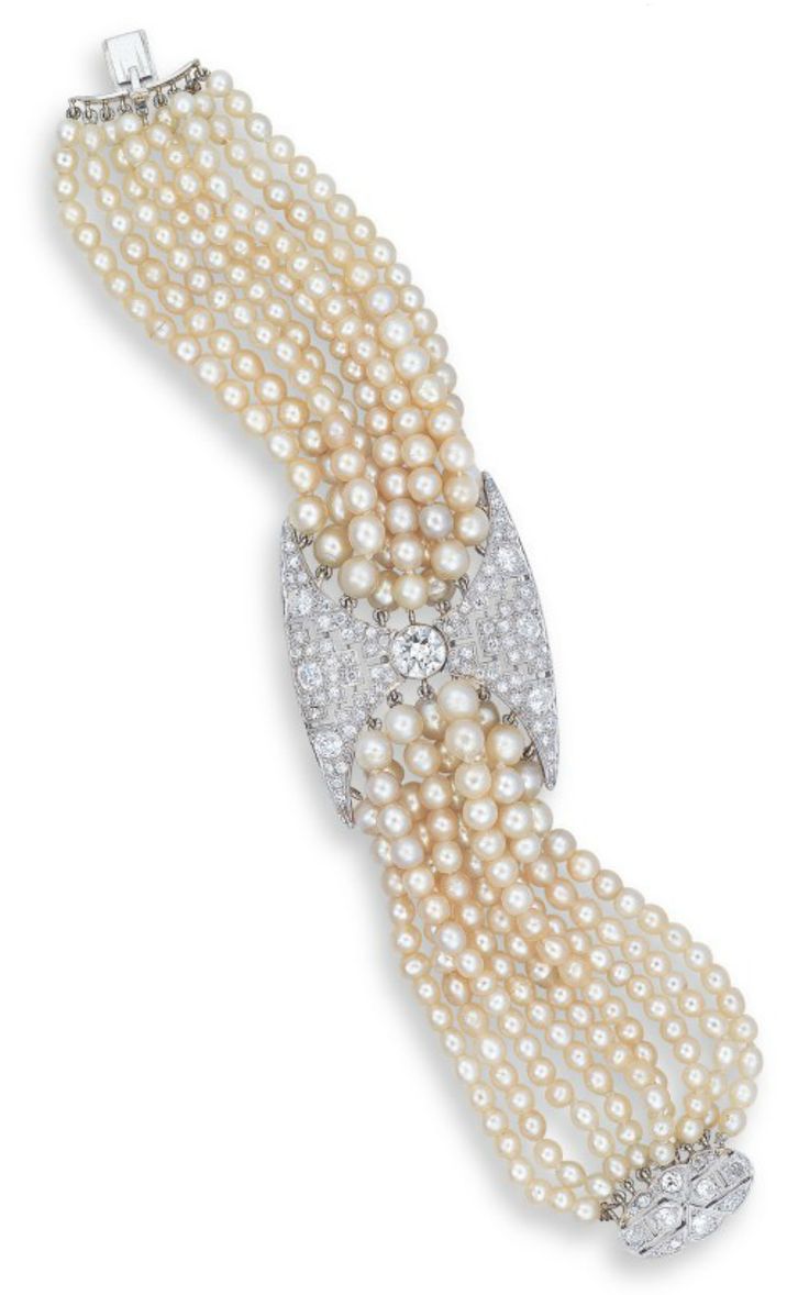 A NATURAL PEARL, PEARL AND DIAMOND BRACELET CENTERING UPON AN OLD EUROPEAN-CUT...