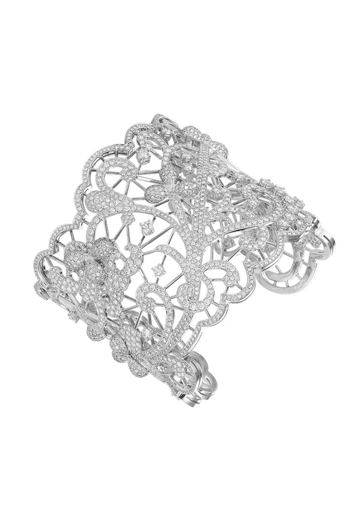 The dazzling beauty of this cuff bracelet in 18-karat white gold, with its fine ...