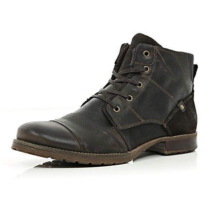 Dark brown panelled military boots.