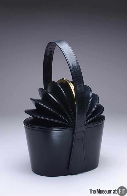 1949 Bogan black leather bag with gold tone metal.