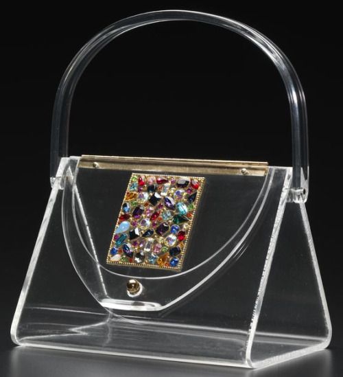 Lucite Lux purse, 1950s. Ladies changed the color of the purse by changing which...