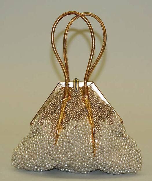 The purse dates to 1933 and is in the collection of the Metropolitan Museum of A...