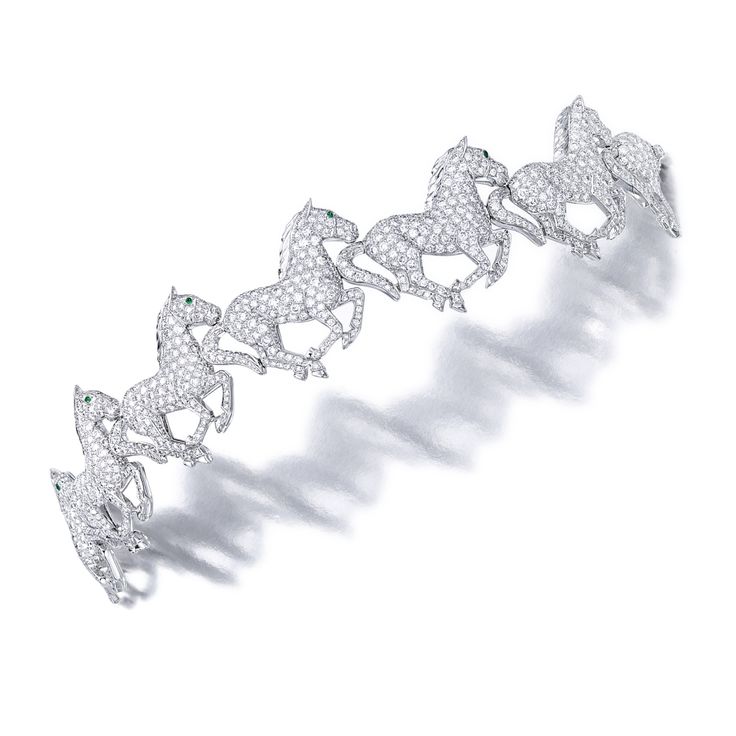 Diamond and Emerald ‘Horse’ Bracelet, Cartier Composed of six pavé-set circ...