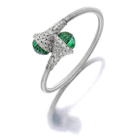 An emerald and diamond bangle