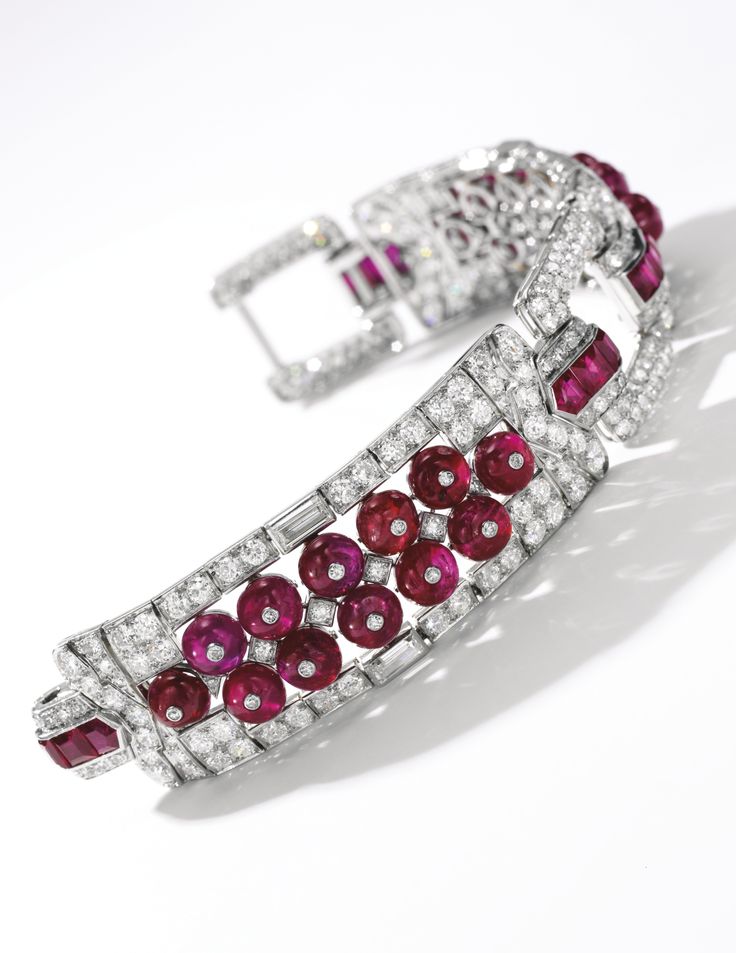 Fine ruby and diamond bracelet, Cartier, circa 1925 Of geometric design, set wit...