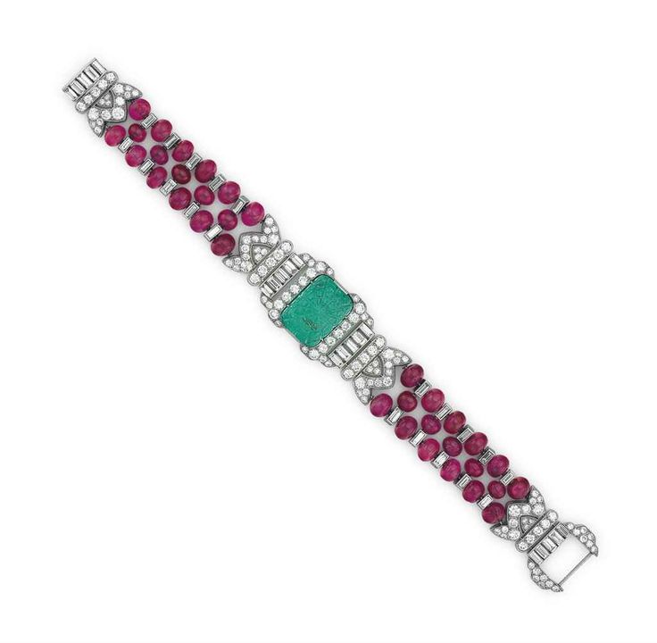 AN ART DECO EMERALD, RUBY AND