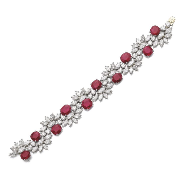 RUBY AND DIAMOND BRACELETSet with oval and cushion-shaped rubies, highlighted wi...