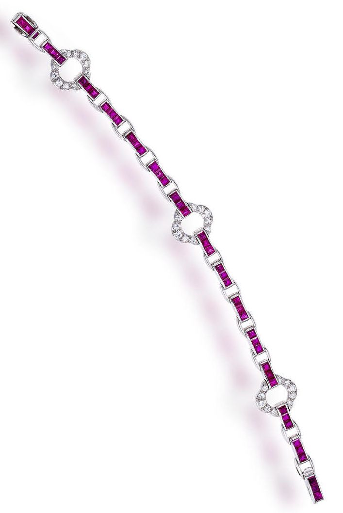 A ruby and diamond bracelet, Cartier, circa 1935 composed of quatrefoil links se...