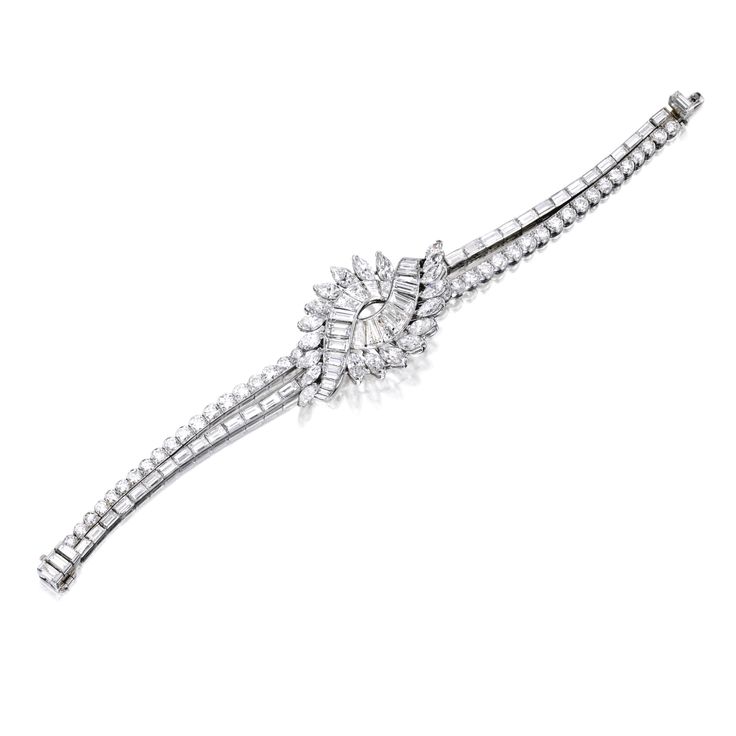 PLATINUM AND DIAMOND BRACELET, VAN CLEEF & ARPELS The tapered strap centering a ...