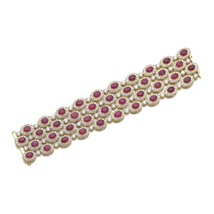 Ruby and diamond bracelet, Bulgari. Set with oval rubies framed with brilliant-c...