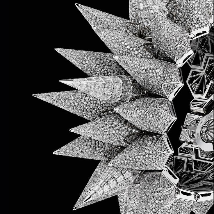 The spikes are set with 9,923 brilliant cut diamonds using the snow setting tech...