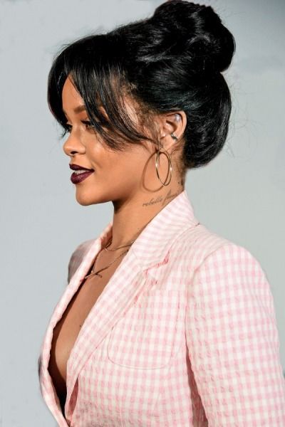 Rihanna hairstyle. Hair bun. Checked blazer. Pale pink.