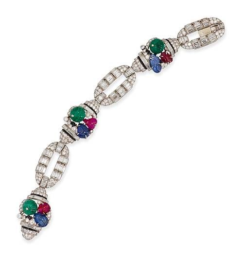 This Art Deco tutti frutti bracelet was made by Mauboussin in 1930. It presents ...