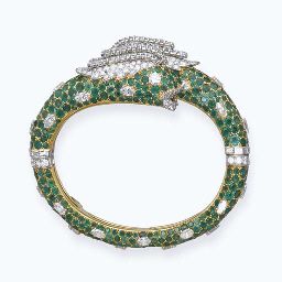 AN EMERALD AND DIAMOND 'CHIMAERA' BANGLE, BY CARTIER. Designed as two pavé-set ...