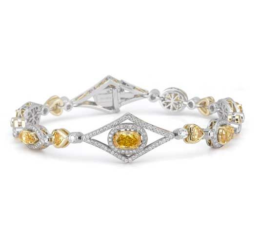 Beautiful color diamond bracelet in 18 carat white gold from from Michael Beaudr...