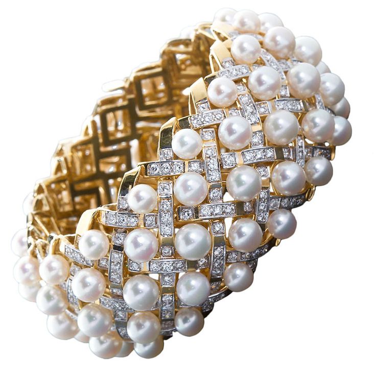 Dazzling and fabulous 18kt gold cuff with pearls and criss-cross diamond motif. ...